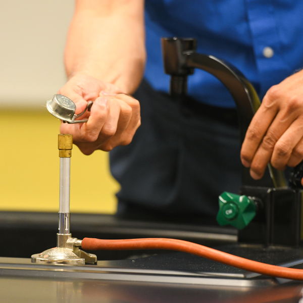 Lighting a Bunsen burner.