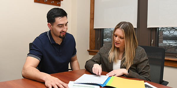 Male student with female staff member.
