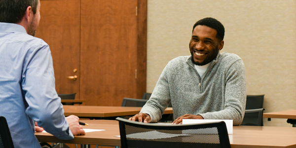 Student working with an interviewer.