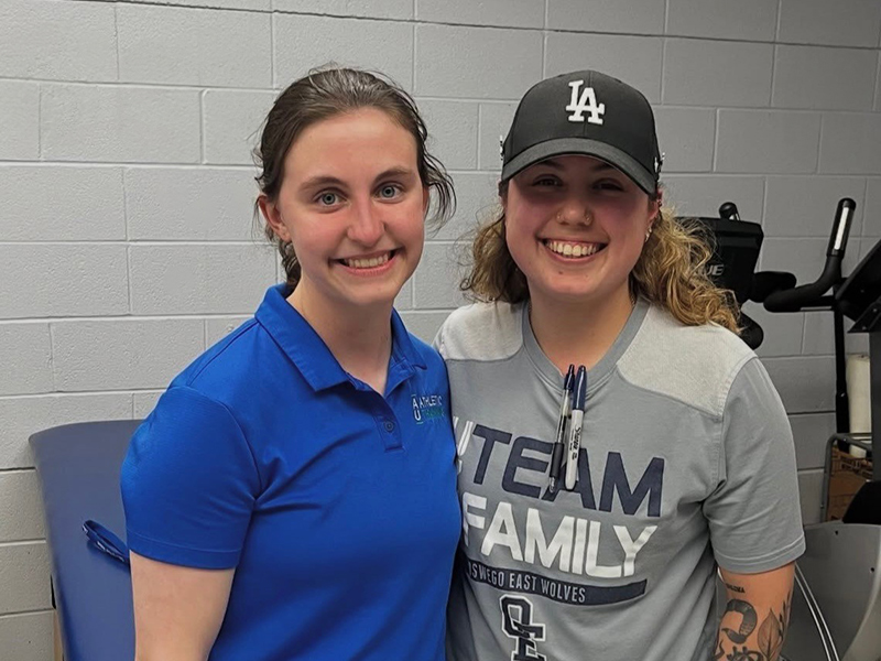 Khya Phillippe '25, '26 works with Tori Agundez '24 in an athletic training room