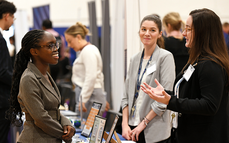 Employers and students at a career fair.